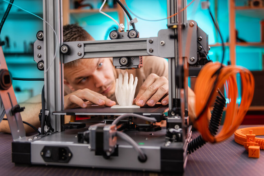 Engineer examining results of 3D printed hand model