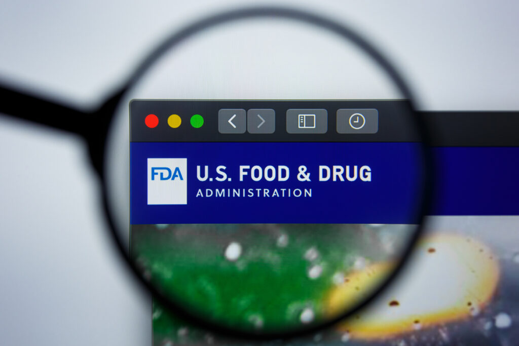 Magnifying glass looking at FDA website