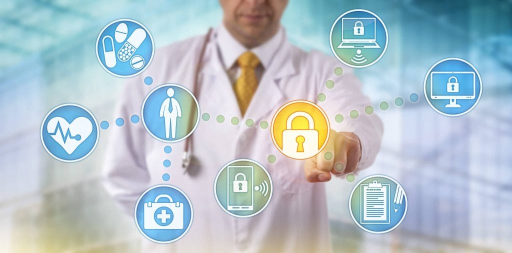 doctor pointing to screen with icons