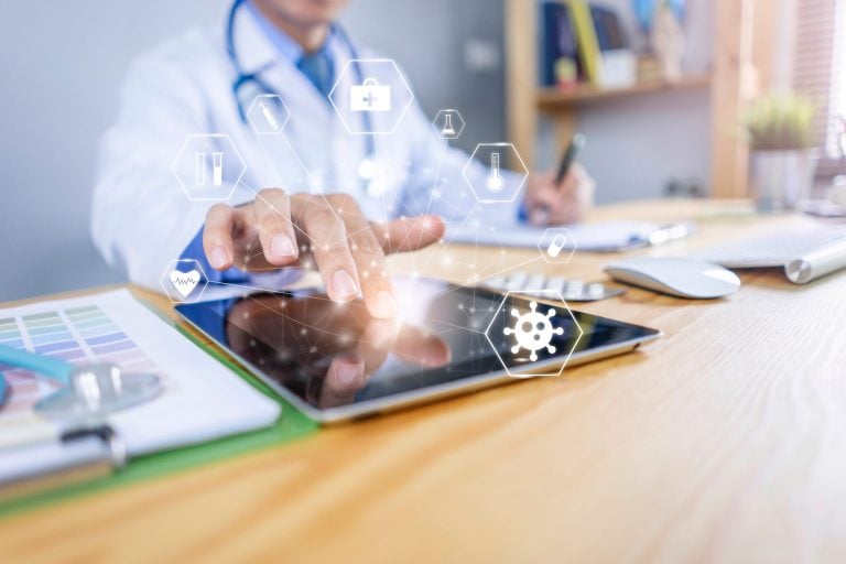 Doctor using tablet for medical research development.