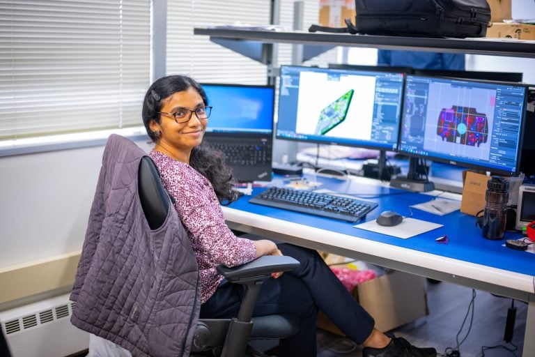 Medical device engineer working at desk