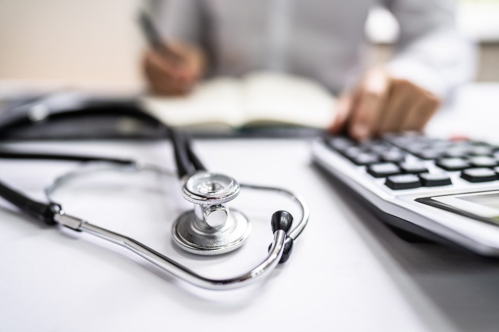 Professional calculating medical device finances.