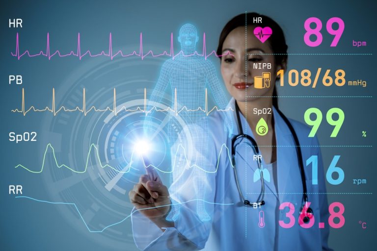 Doctor examining patient monitoring system