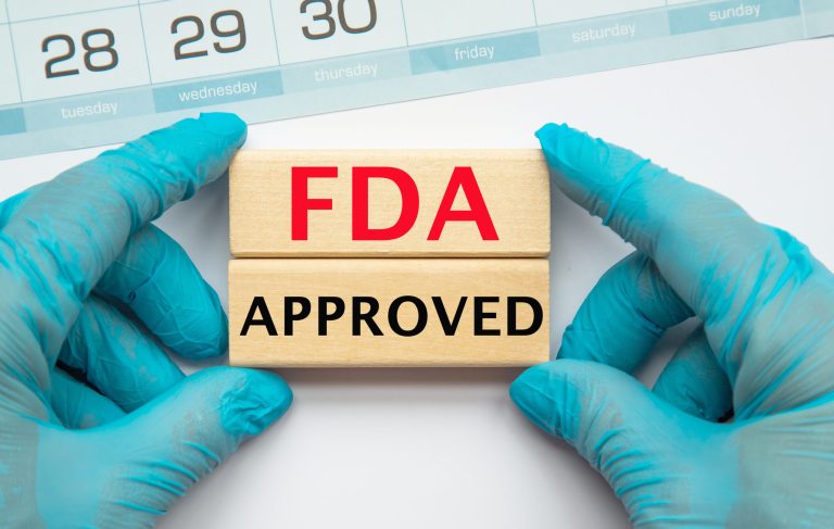 Doctors hands showed FDA approval sign